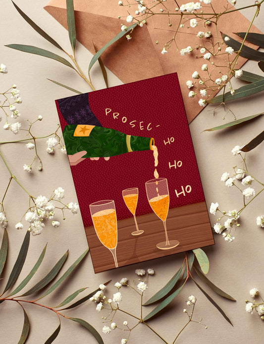Card with champagne glasses and text 'Prosecco Ho Ho Ho' surrounded by flowers and leaves on a beige background